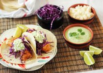 Beer Battered Fish Tacos with Cilantro Crema served