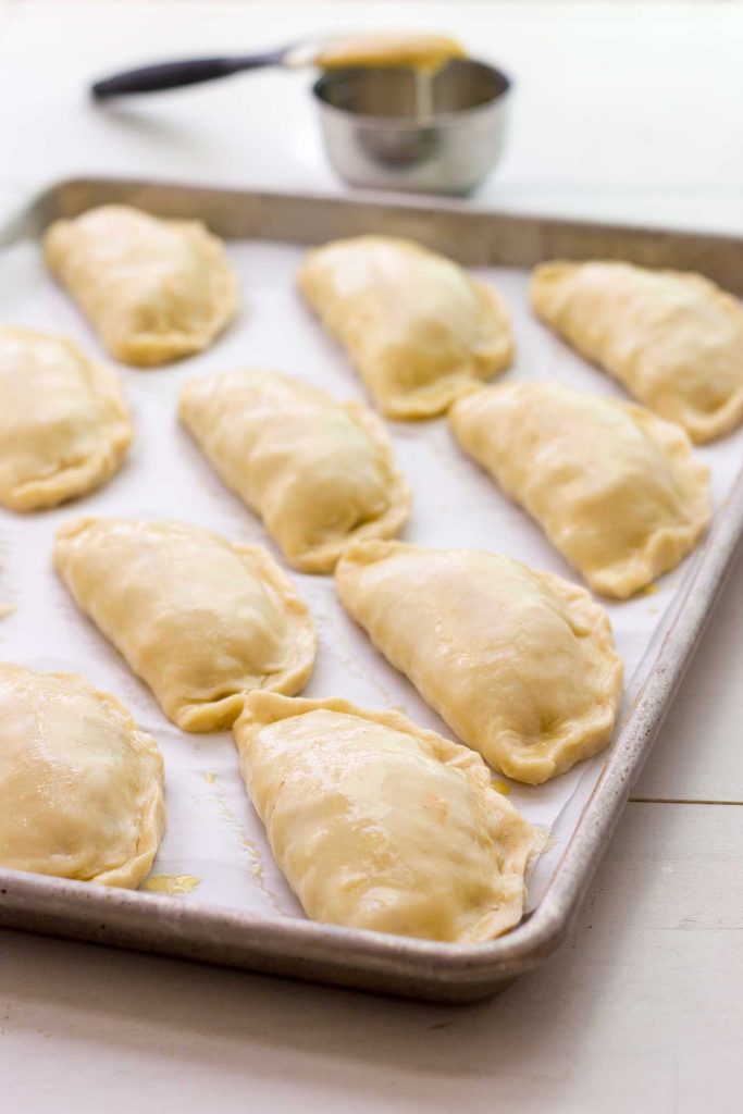 empanadas in baking sheet
